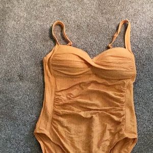 Nip tuck bathing suit